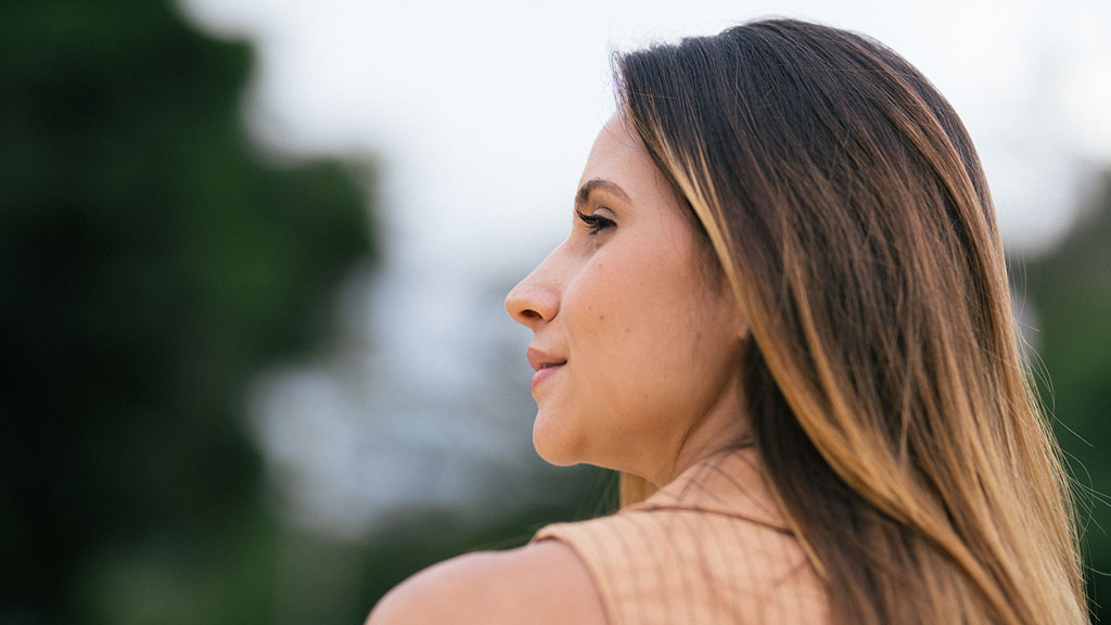 Mindplace mental health assessment banner featuring a person outdoors in a reflective moment