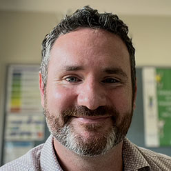 Headshot of Barry John